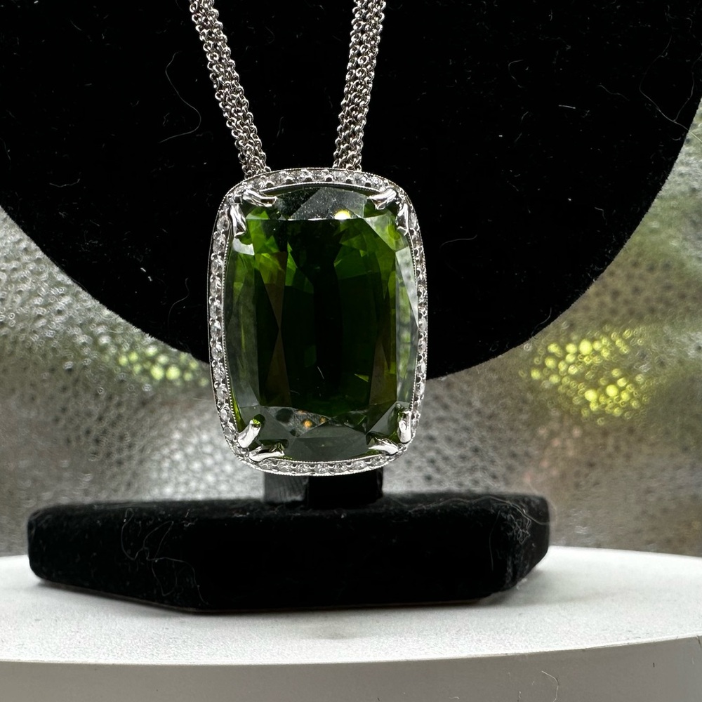 Peridot 44.98 carat super gem with diamond setting